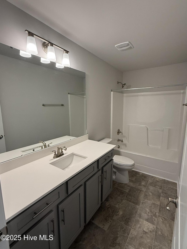 full bathroom featuring toilet, visible vents, shower / washtub combination, and vanity