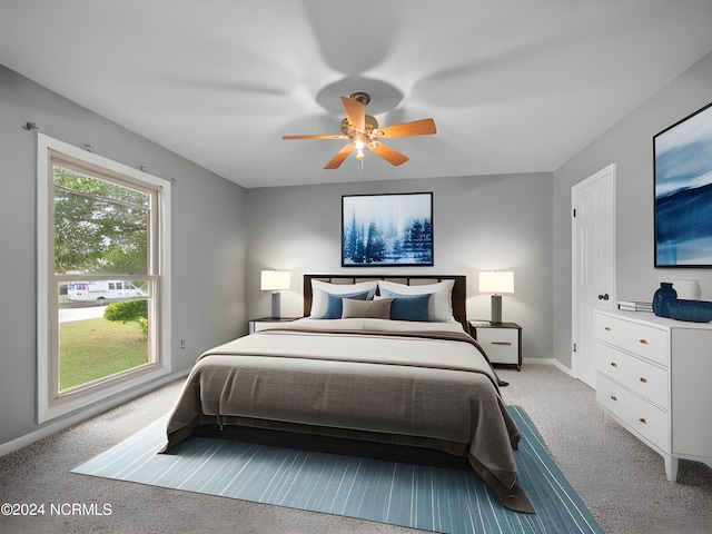 carpeted bedroom featuring ceiling fan