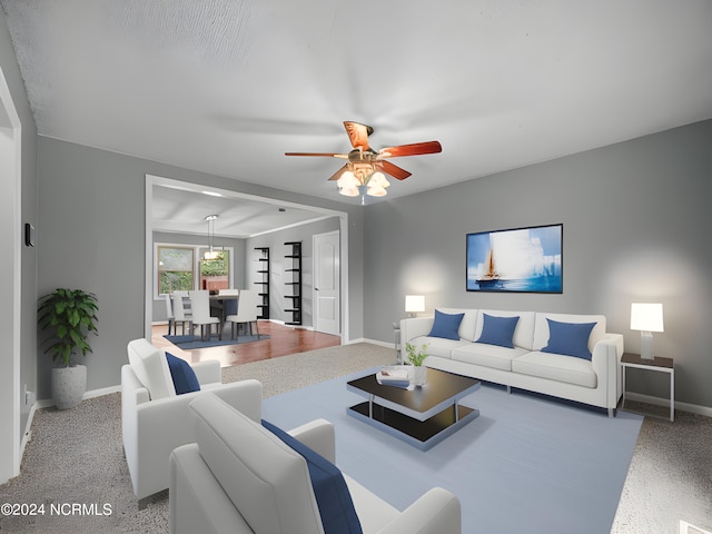 carpeted living room with ceiling fan