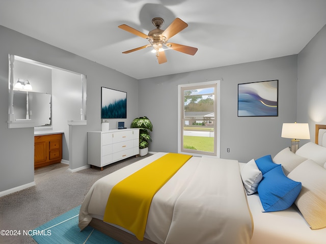 bedroom with ceiling fan, carpet flooring, connected bathroom, and baseboards