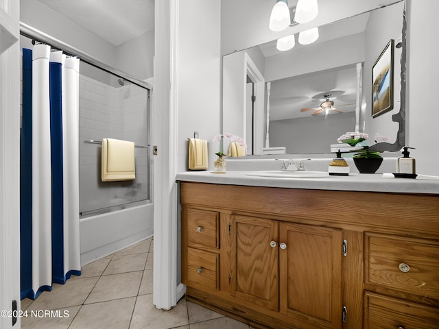 bathroom featuring combined bath / shower with glass door, tile patterned floors, vanity, and ceiling fan