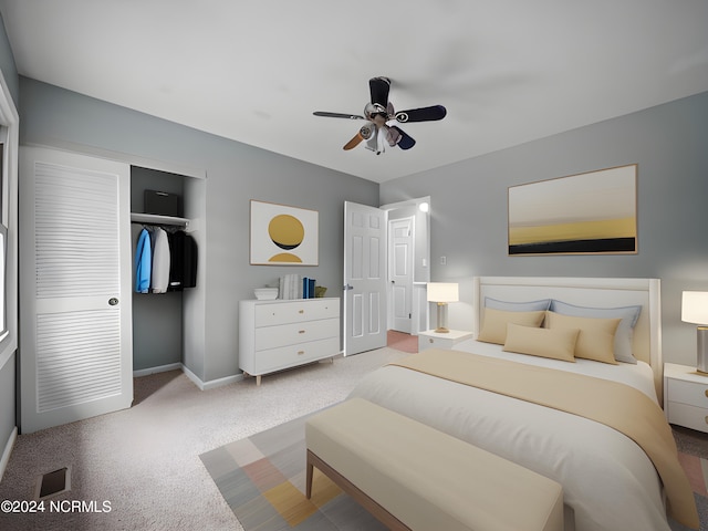 bedroom with a closet, light colored carpet, visible vents, ceiling fan, and baseboards