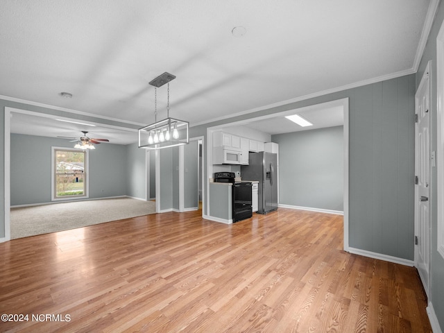 unfurnished living room featuring light hardwood / wood-style floors, ceiling fan with notable chandelier, and crown molding