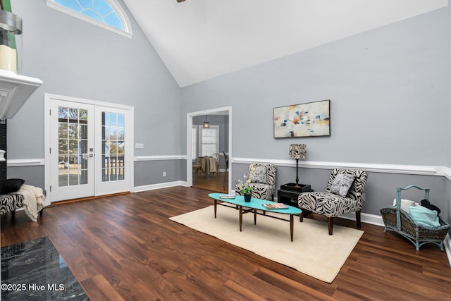 sitting room featuring dark hardwood / wood-style flooring, high vaulted ceiling, and french doors