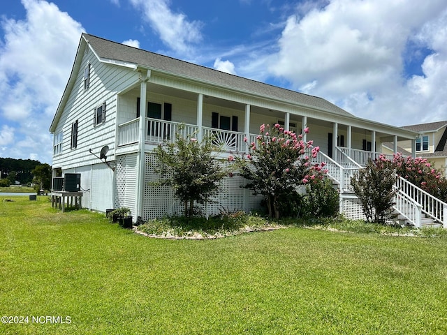 view of side of property with a lawn