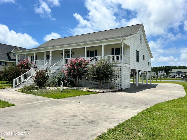 view of front of property with a carport and a porch