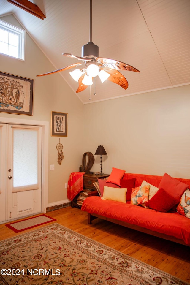 living room with high vaulted ceiling, hardwood / wood-style floors, and ceiling fan