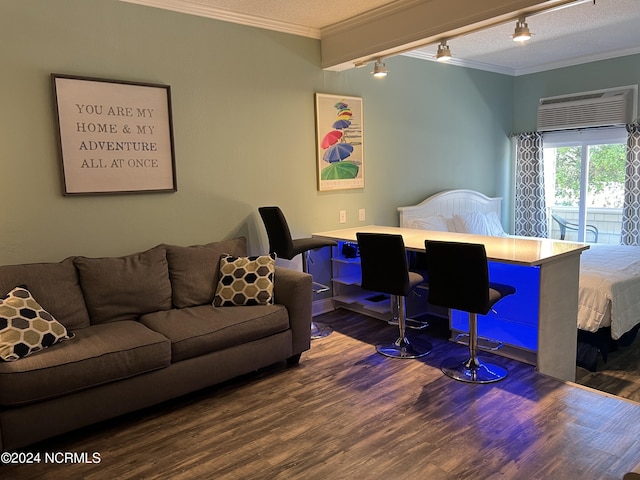 living room featuring crown molding, dark wood-type flooring, a wall mounted AC, track lighting, and a textured ceiling