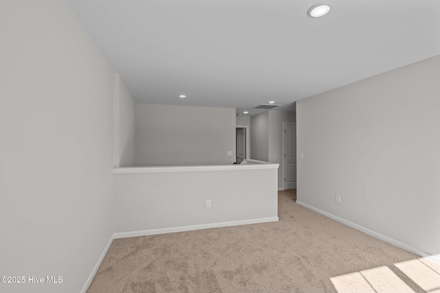 spare room with light carpet