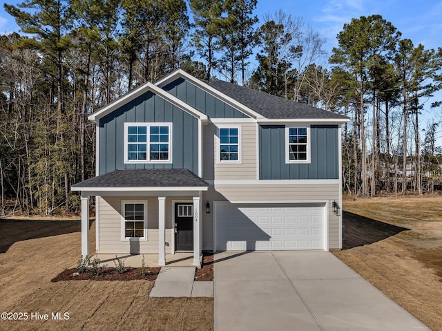 view of front of property with a garage and covered porch