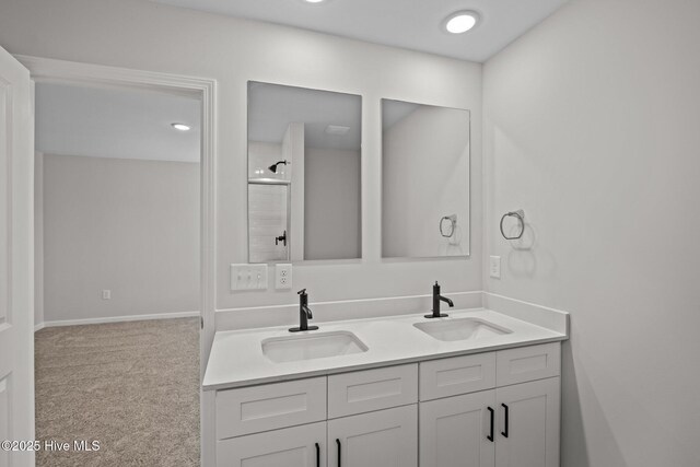 bathroom featuring vanity and a shower