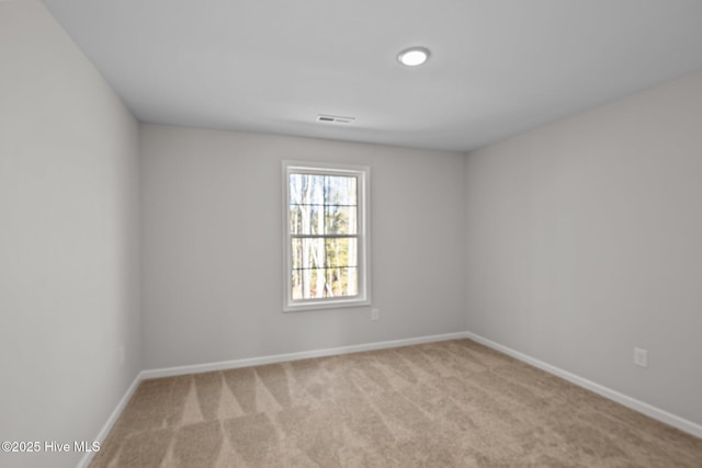 empty room with light colored carpet