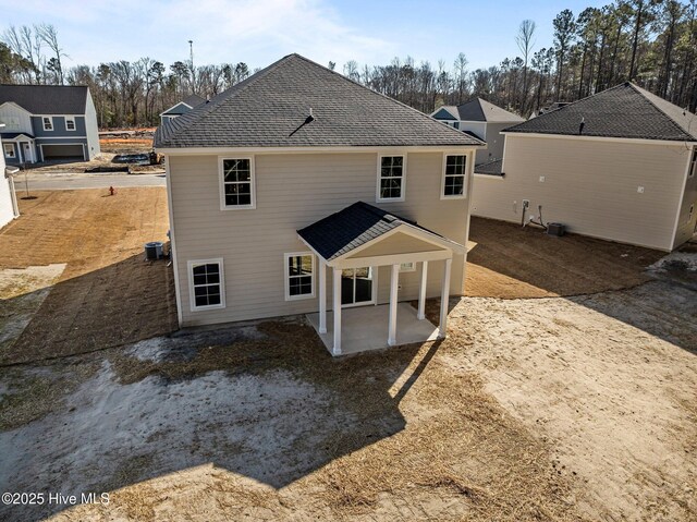 back of house with a patio