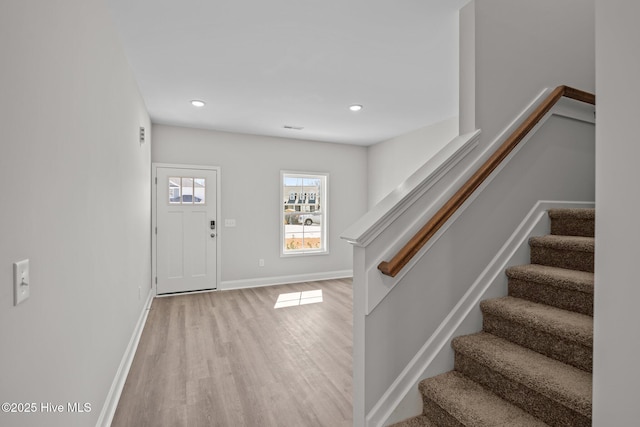 entryway with light hardwood / wood-style flooring