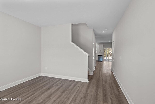 corridor featuring dark hardwood / wood-style floors