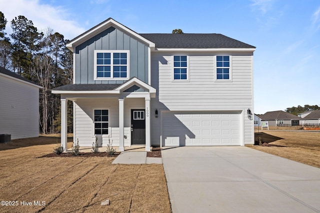 view of front of home with cooling unit, a porch, a garage, and a front lawn