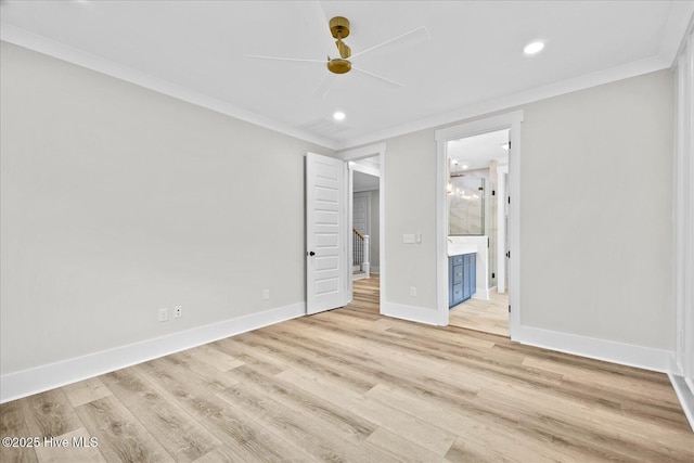 unfurnished bedroom with crown molding, light hardwood / wood-style flooring, ceiling fan, and ensuite bathroom