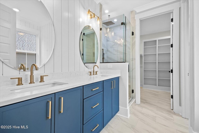 bathroom with vanity and a shower with shower door