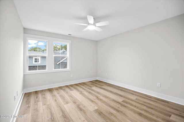 unfurnished room featuring ceiling fan and light wood-type flooring