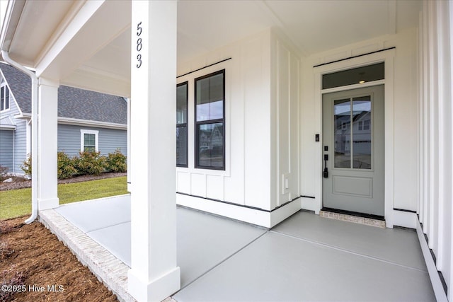 doorway to property featuring covered porch