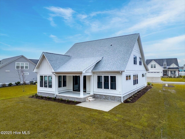 back of property featuring a yard and a patio area