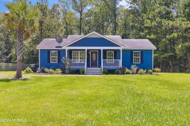 ranch-style house with a porch and a front lawn