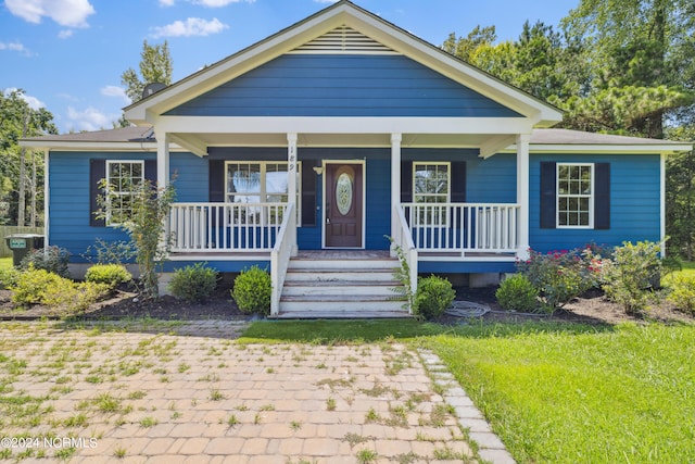 bungalow-style house featuring covered porch