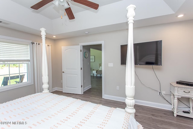 bedroom with ceiling fan and dark hardwood / wood-style flooring