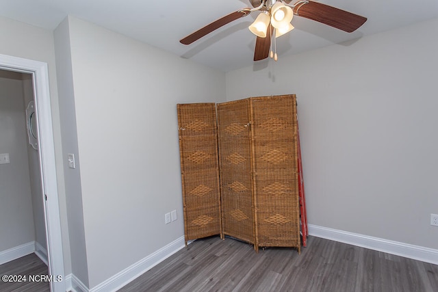 unfurnished bedroom featuring ceiling fan, wood-type flooring, and a closet