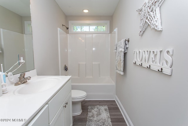 full bathroom featuring shower / bathtub combination, vanity, hardwood / wood-style floors, and toilet