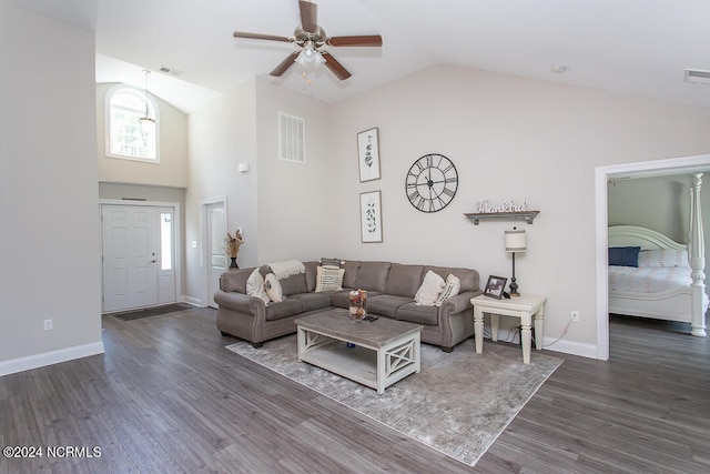 living room with high vaulted ceiling, ceiling fan, and dark hardwood / wood-style floors