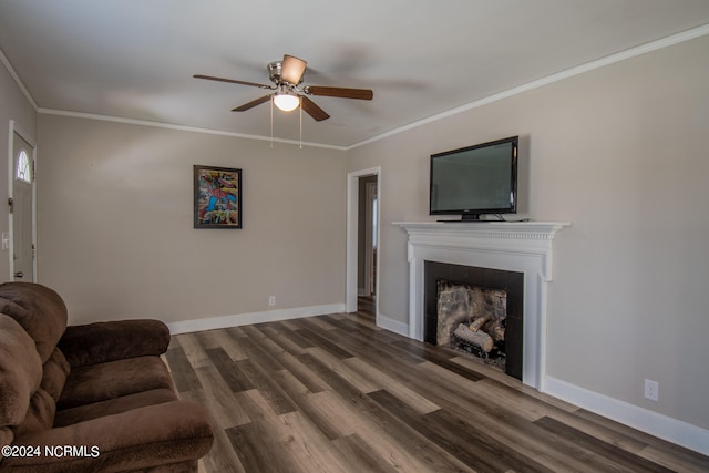 living room featuring ceiling fan, hardwood / wood-style flooring, and crown molding