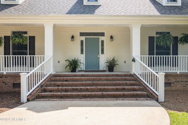 property entrance featuring a porch