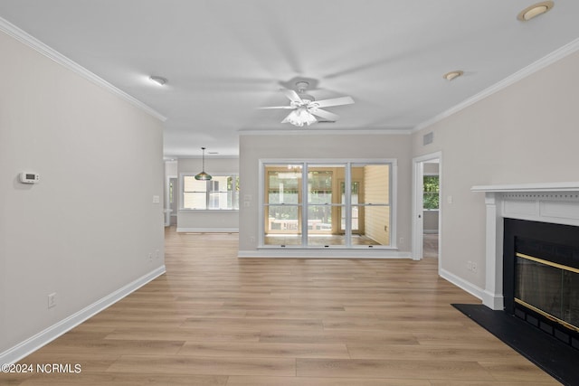 unfurnished living room with ceiling fan, crown molding, and light hardwood / wood-style flooring