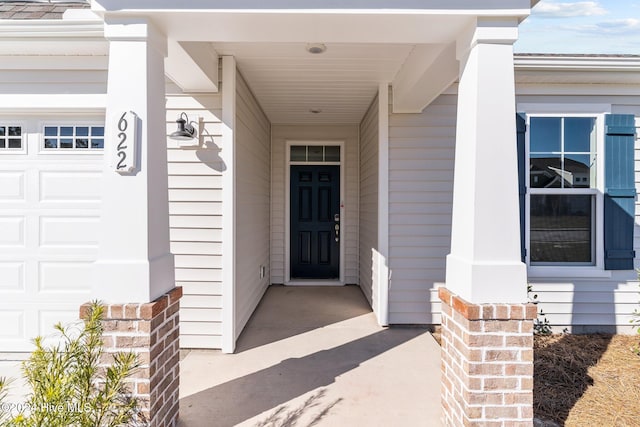 view of exterior entry featuring a garage