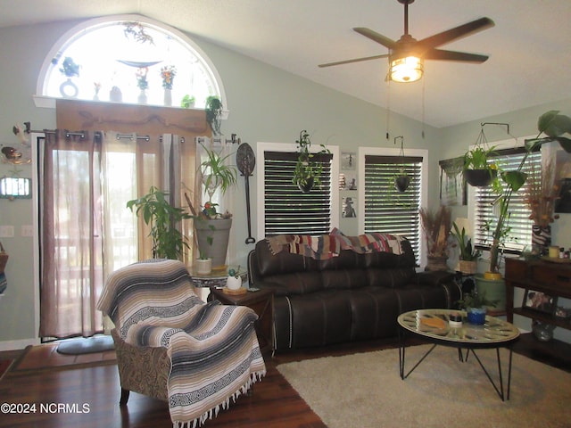 living room featuring lofted ceiling, a healthy amount of sunlight, wood-type flooring, and ceiling fan