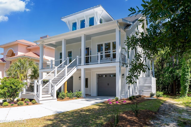 view of front of house featuring a garage and covered porch