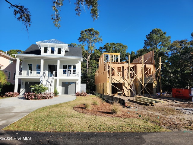 view of front facade with a porch and a garage