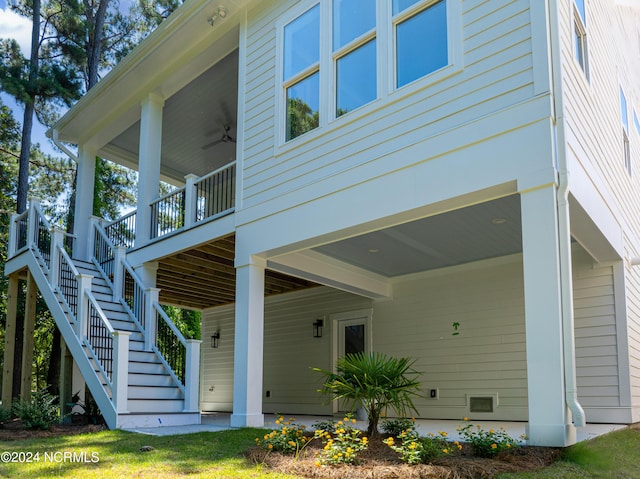 exterior space featuring ceiling fan