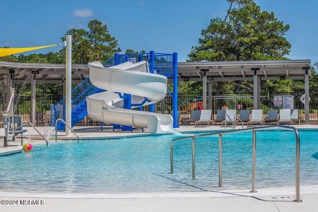 view of swimming pool featuring a water slide