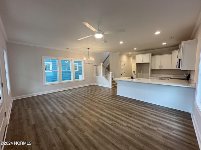 kitchen featuring dark hardwood / wood-style floors, sink, white cabinetry, and ornamental molding