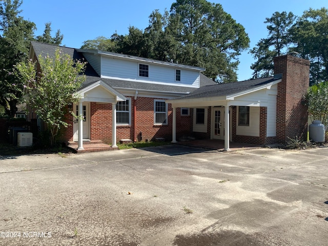 view of property featuring covered porch