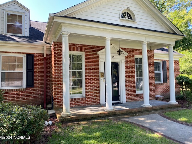 property entrance with covered porch