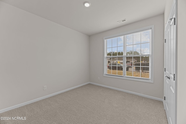 view of carpeted spare room