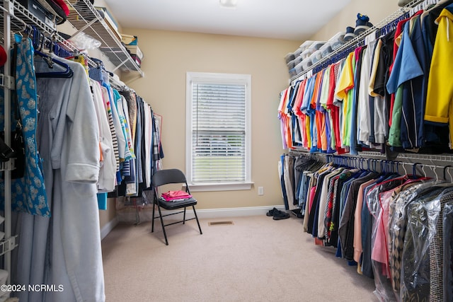 walk in closet featuring carpet floors and visible vents