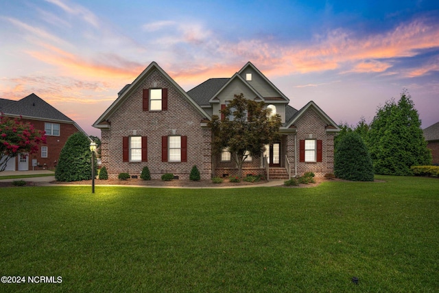 view of front of property featuring crawl space, a front lawn, and brick siding