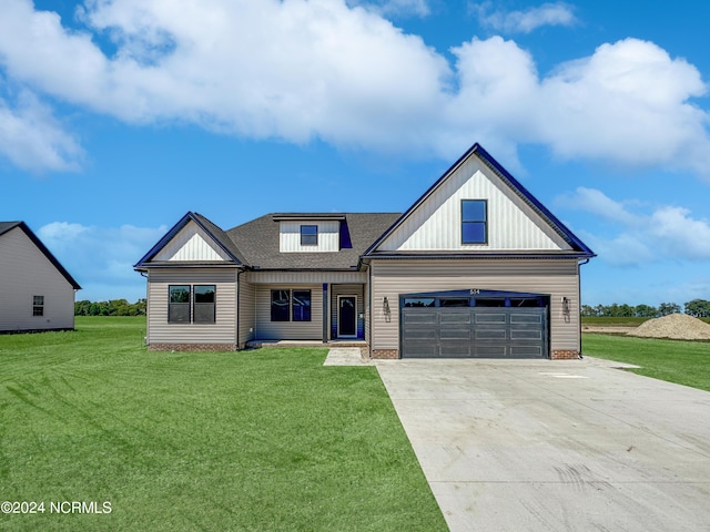 modern inspired farmhouse with a garage, a shingled roof, concrete driveway, board and batten siding, and a front yard