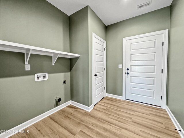 laundry area with hookup for an electric dryer, light wood-type flooring, and washer hookup