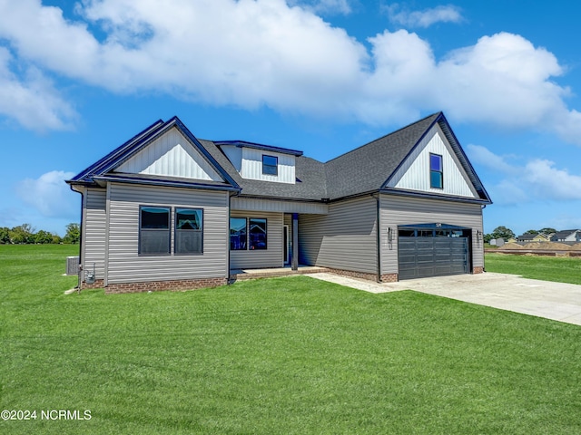 modern farmhouse style home with a shingled roof, concrete driveway, and a front lawn