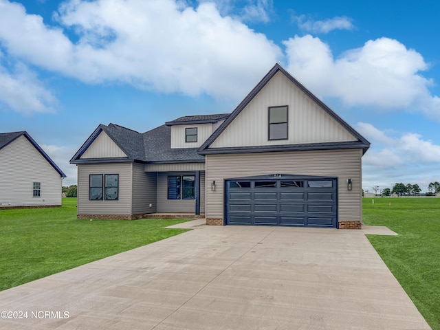 modern farmhouse style home featuring concrete driveway, a front lawn, and roof with shingles